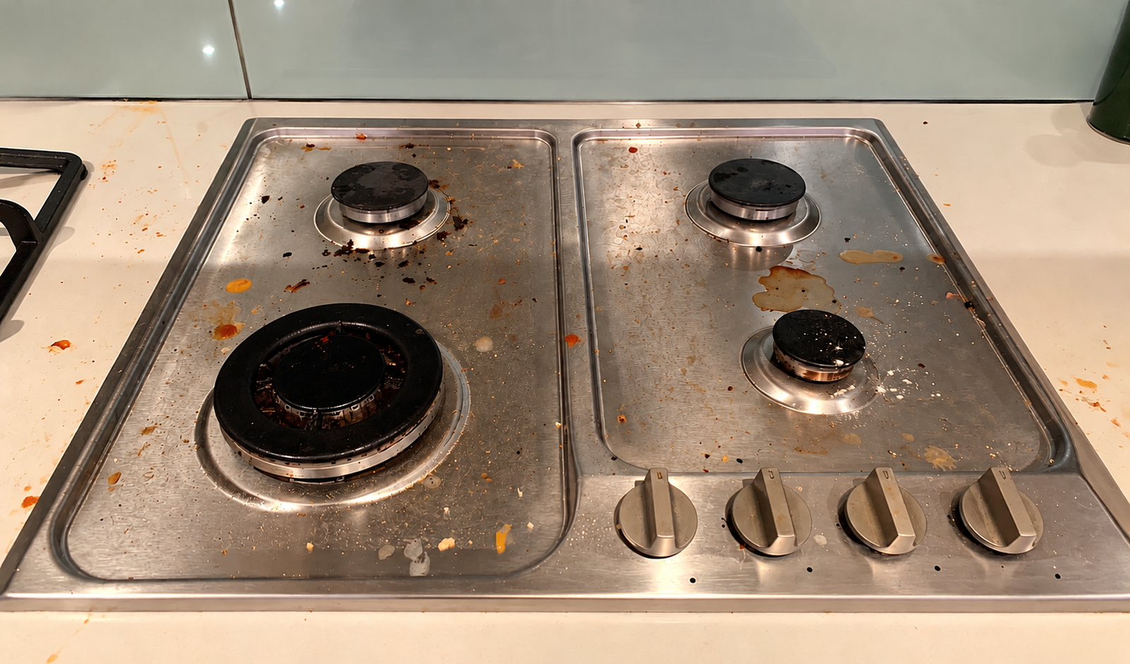 Messy Stainless Steel Stovetop Close-Up